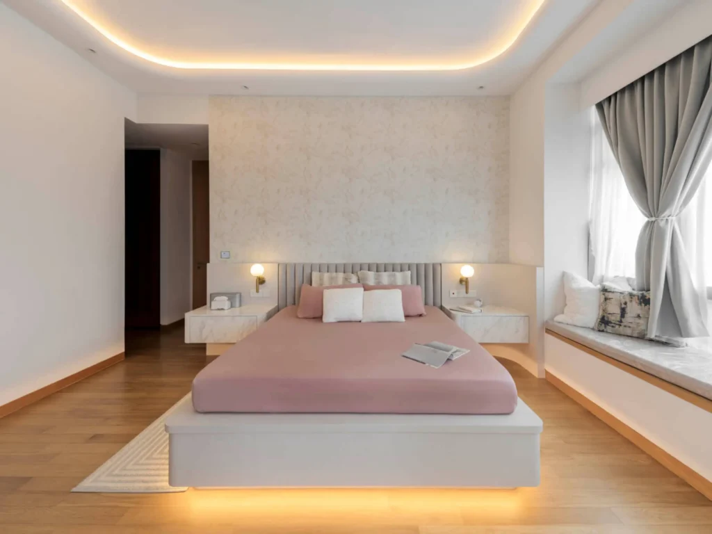 HDB master bedroom with platform bed, feature wall and layered cove lighting by Lemonfridge Studio