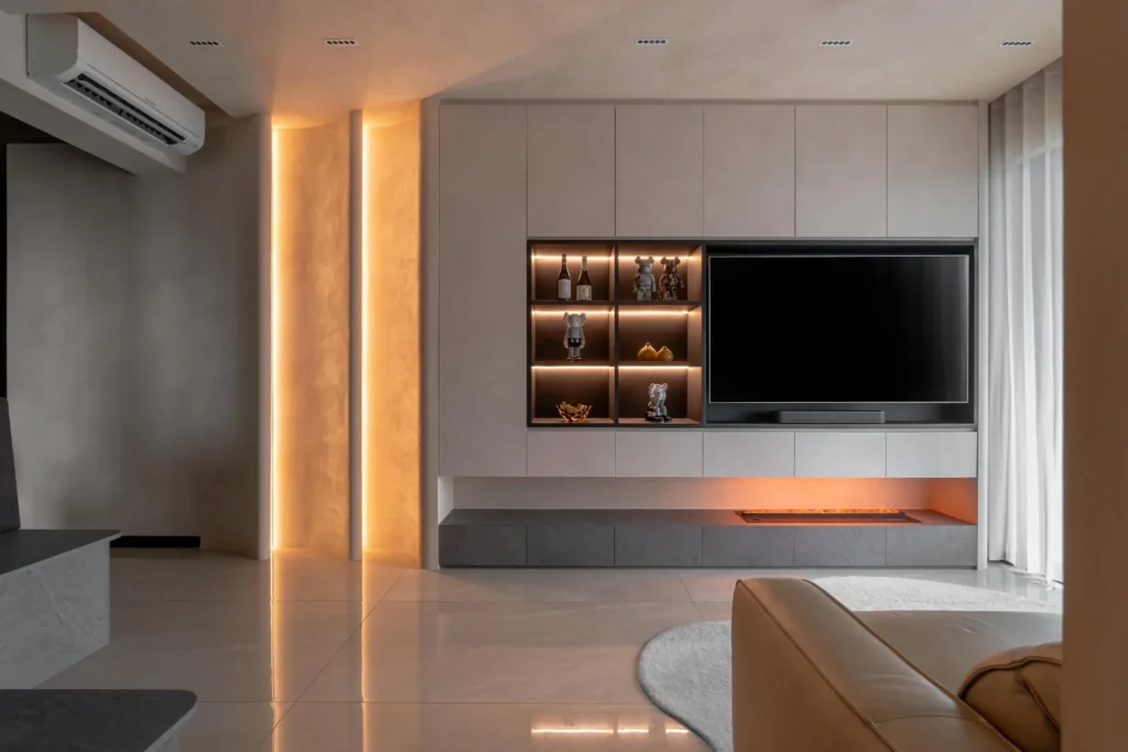 Premium living room with feature wall, warm light, and built-in storage design ideas