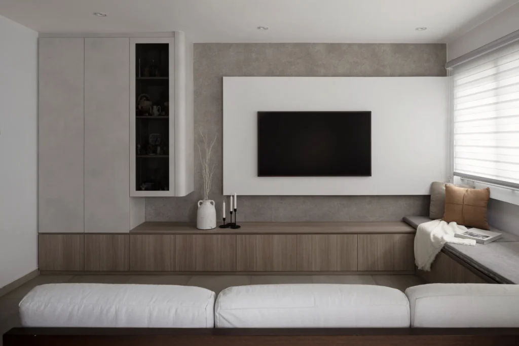 Modern living room TV console, neutral walls, and space-saving furniture