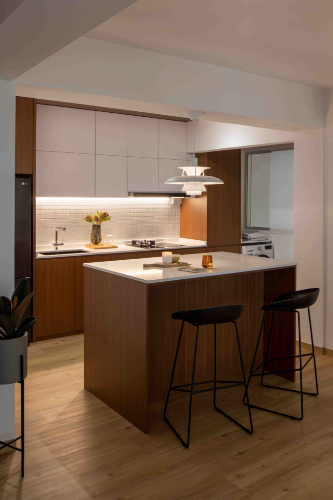 Small kitchen design with compact U-shape, wood island, pendant accent light and under-cabinet LEDs