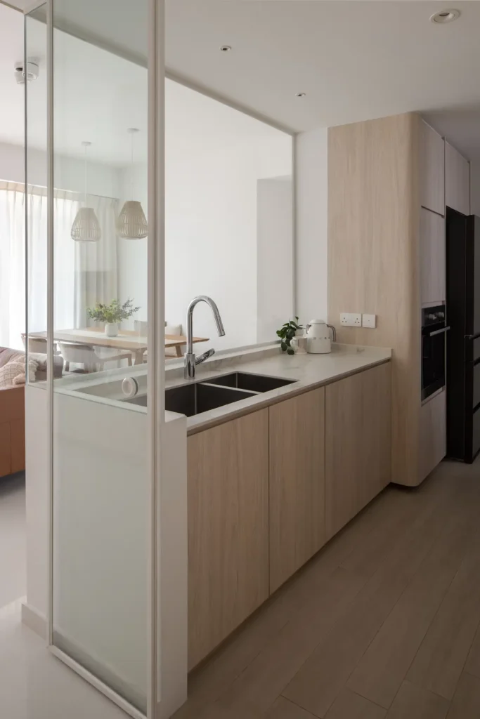 Glass partition and bright Scandinavian kitchen