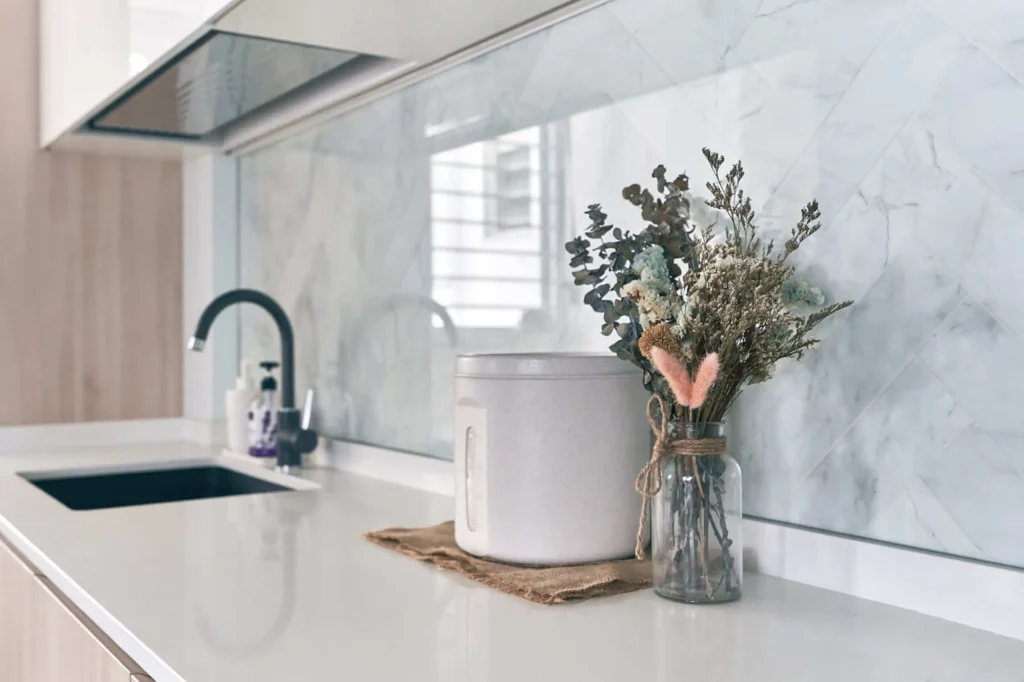 Scandinavian kitchen with natural light, white walls and light wood cabinets
