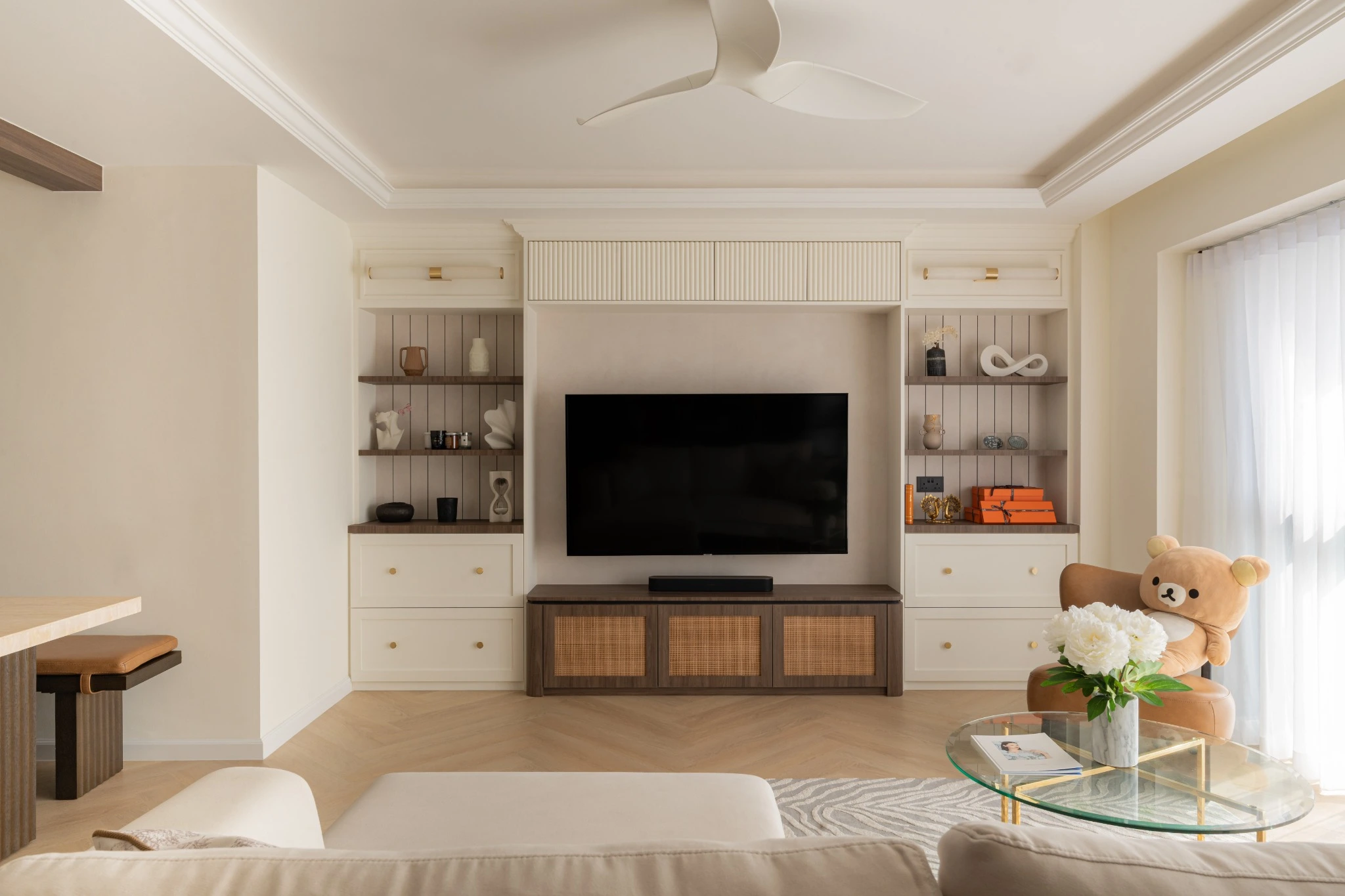 Custom HDB media wall with built-in drawers, open shelves and cane panels for concealed storage, Singapore