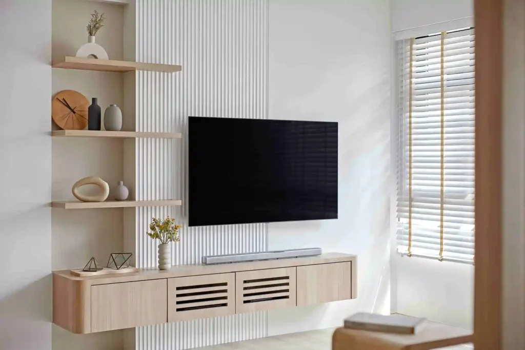 Minimalist TV wall with fluted panel, floating oak console and open shelving