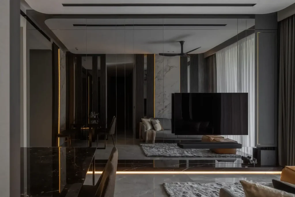 Moody modern luxury living room with marble accents, dark timber slats, ambient strip lighting, and glossy flooring.