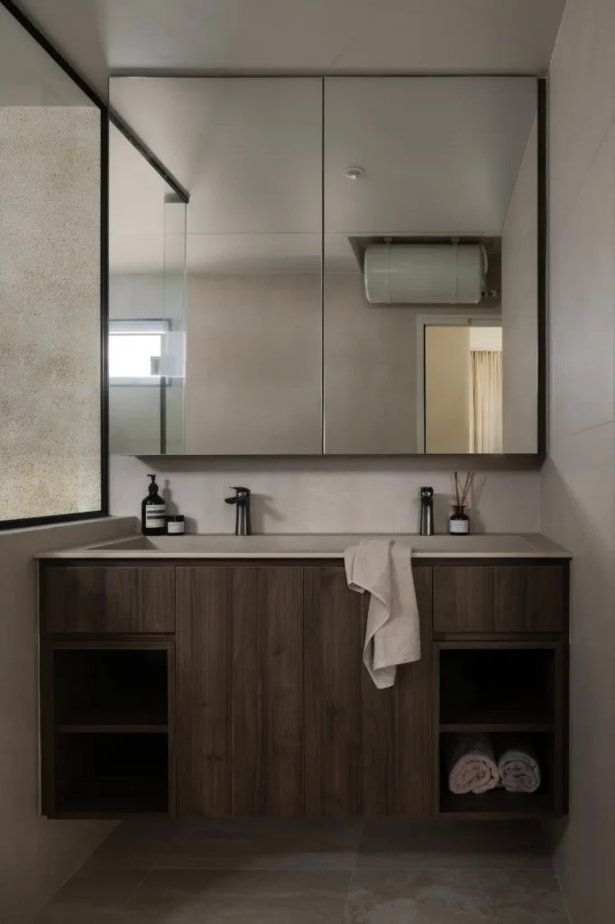 Premium wood-accented vanity with dual basins and matte black fixtures in Singapore HDB toilet renovation by Lemonfridge